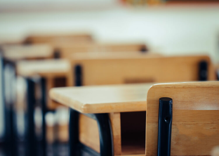 Back to school concept. School empty classroom, Lecture room with desks and chairs iron wood for studying lessons in highschool thailand without young student, interior of secondary education