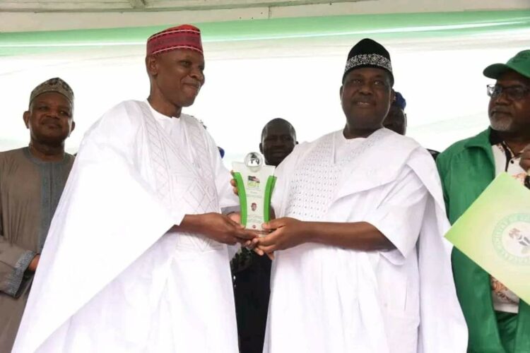 Secretary to the Government of the Federation Sen. George Akume, flanked by the Minister of Budget and National Planning Sen. Atiku Bagudu and Minister of State for Education Tanko Sunusu presenting a prestigious award for the outstanding performance in education reform to Gov. Abba Kabir Yusuf of Kano State at the Eagle Square, Abuja on Saturday 5th Octorber, 2024 as part of the activities marking the 2024 World Teachers Day