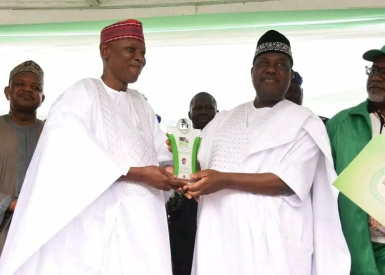 Secretary to the Government of the Federation Sen. George Akume, flanked by the Minister of Budget and National Planning Sen. Atiku Bagudu and Minister of State for Education Tanko Sunusu presenting a prestigious award for the outstanding performance in education reform to Gov. Abba Kabir Yusuf of Kano State at the Eagle Square, Abuja on Saturday 5th Octorber, 2024 as part of the activities marking the 2024 World Teachers Day