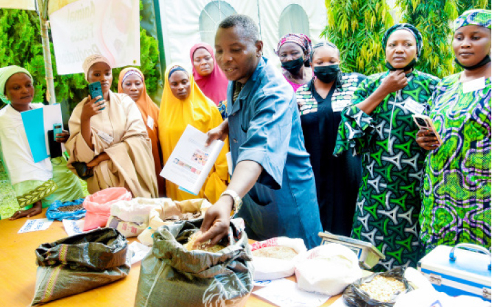 100 Empowered As LEADERSHIP, Nasarawa’s Skills Training Ends In Abuja 1 CEO Fans Dream Business Concept Ltd, Jacob Fanen Yyonongu with trainees in animal feeds production