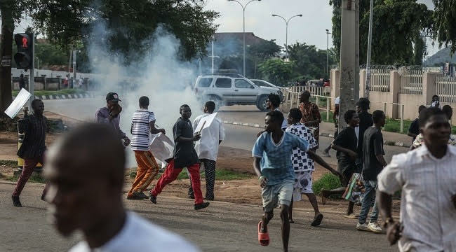 JUST-IN: Police Fire Teargas At Protesters In Abuja 1 Protesters 1