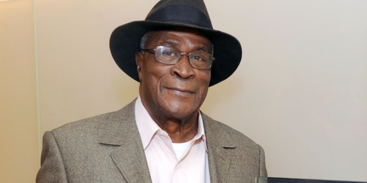 Late John Amos.