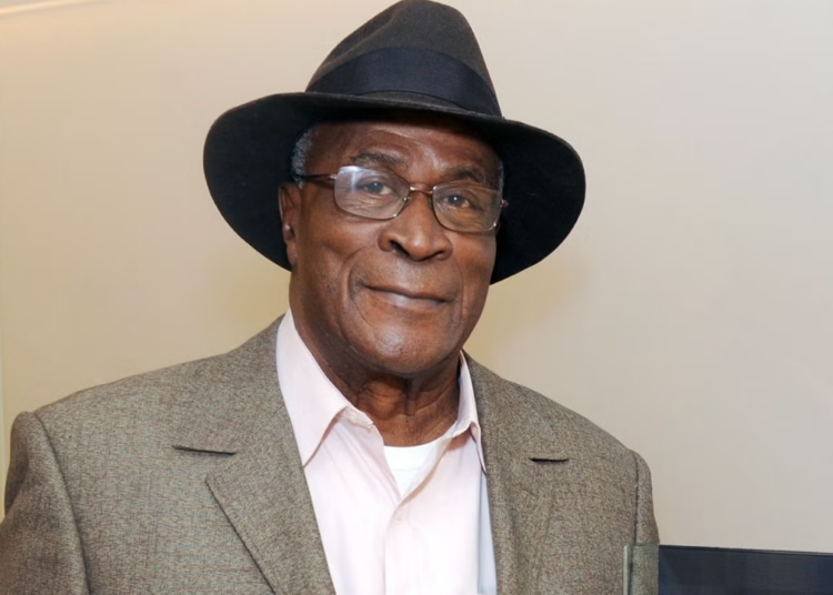 Late John Amos.