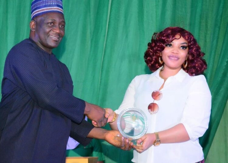 Abuja Branch Manager, Ms. Julie Obiaeli receiving the award on behalf of the Company