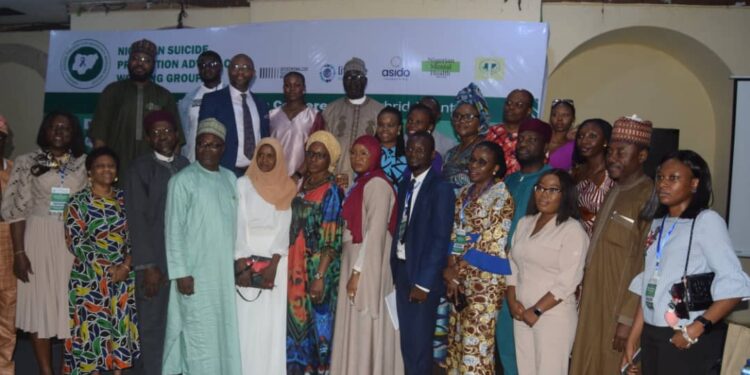 Members of the National Suicide Prevention Advocacy Working Group (NSPAWG) after the conference in Abuja.