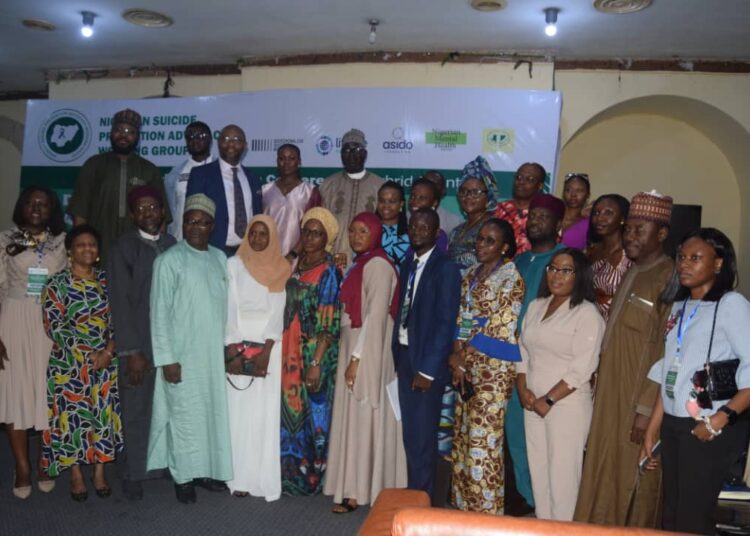 Members of the National Suicide Prevention Advocacy Working Group (NSPAWG) after the conference in Abuja.