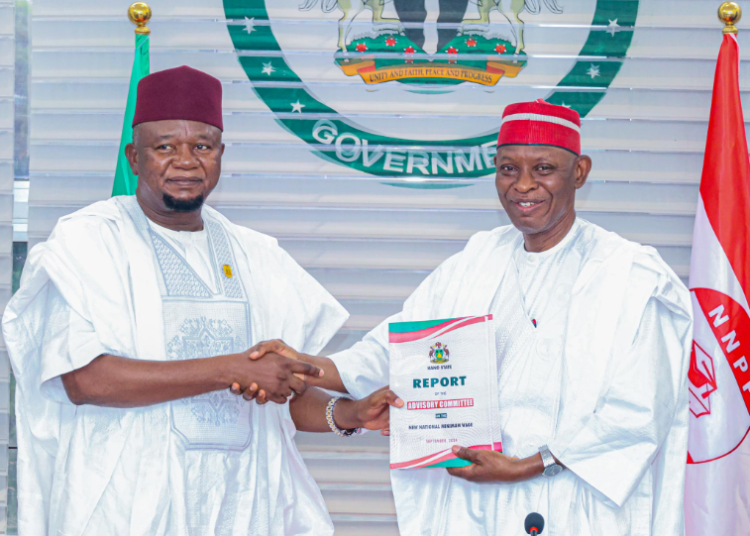 Kano State Governor, Abba Kabiru Yusuf,  receiving the Minimum Wage report from the Chairman of the Minimum Wage Advisory committee,  Alhaji Usman Bala, mni on Tuesday.