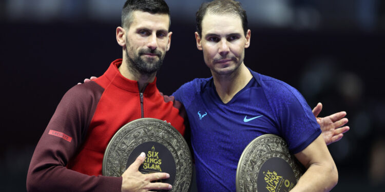 RIYADH, SAUDI ARABIA - OCTOBER 19: Novak Djokovic of Serbia (left) poses for a photo with Rafael Nadal of Spain after defeating him to win the Men's Singles Third Place Playoff match on day three of the Six Kings Slam 2024 at Kingdom Arena on October 19, 2024 in Riyadh, Saudi Arabia. (Photo by Richard Pelham/Getty Images)