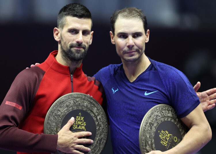 RIYADH, SAUDI ARABIA - OCTOBER 19: Novak Djokovic of Serbia (left) poses for a photo with Rafael Nadal of Spain after defeating him to win the Men's Singles Third Place Playoff match on day three of the Six Kings Slam 2024 at Kingdom Arena on October 19, 2024 in Riyadh, Saudi Arabia. (Photo by Richard Pelham/Getty Images)