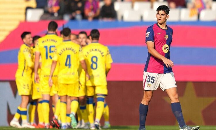 BARCELONA, SPAIN - NOVEMBER 30: Gerard Martin of FC Barcelona looks dejected after Sandro Ramirez of UD Las Palmas (not pictured) scores his team's first goal during the LaLiga match between FC Barcelona and UD Las Palmas at Estadi Olimpic Lluis Companys on November 30, 2024 in Barcelona, Spain. (Photo by Alex Caparros/Getty Images)