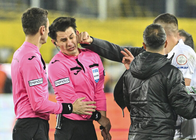 AA's Best Pictures of 2023: Faruk Koca, President of MKE Ankaragucu throws a punch to the referee Halil Umut Meler after the Turkish Super Lig week 15 football match between MKE Ankaragucu and Rizespor at Eryaman Stadium in Ankara, Turkiye on December 11, 2023. The match ended 1-1. Emin Sansar / Anadolu (Photo by Emin Sansar / ANADOLU / Anadolu via AFP)