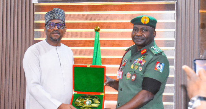 Dikko Pledges Support For African Military Games 1 R-L: Chief of Defence Staff, General Christopher Musa, presenting gift to chairman, National Sports Commission, Shehu Dikko during a visit to the Defence Headquarters in Abuja, yesterday.