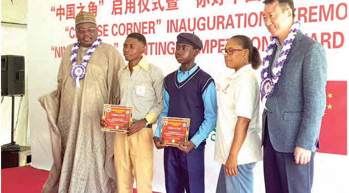 Chinese Ambassador to Nigeria, Yu Dunhai(Fifth from Right) with award winning students and officials of the FCT  Secondary Education Board