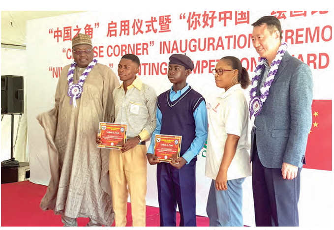 China’s Capacity Building Boosts Nigeria’s Education System 1 Chinese Ambassador to Nigeria, Yu Dunhai(Fifth from Right) with award winning students and officials of the FCT Secondary Education Board