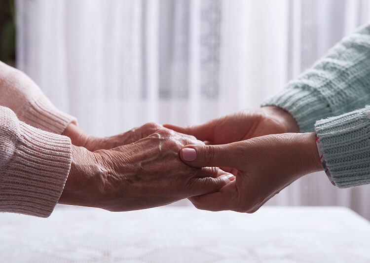 Scholars Decry Lack Of Social Support For Elderly Nigerians 1 Care is at home of elderly. Senior woman with their caregiver at home. Concept of health care for elderly old people, disabled. Elderly woman holding hands closeup. Space for text white background.