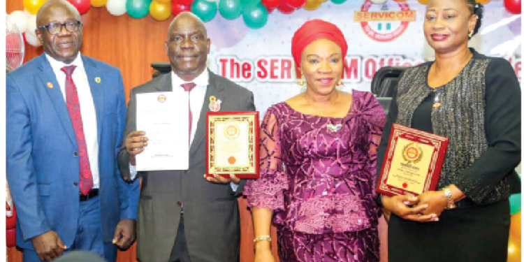 L-R: Executive commissioner, Exploration and Production, Nigerian Upstream Petroleum Regulatory Commission (NUPRC), Enorense Amadasu;  
chief executive, NUPRC, Gbenga Komolafe;  CEO of SERVICOM, Nnenna Akajemeli and head of SERVICOM Unit in NUPRC, Ann Dozie-Enukora after receiving multiple recognitions at the SERVICOM Awards in Abuja on Tuesday.