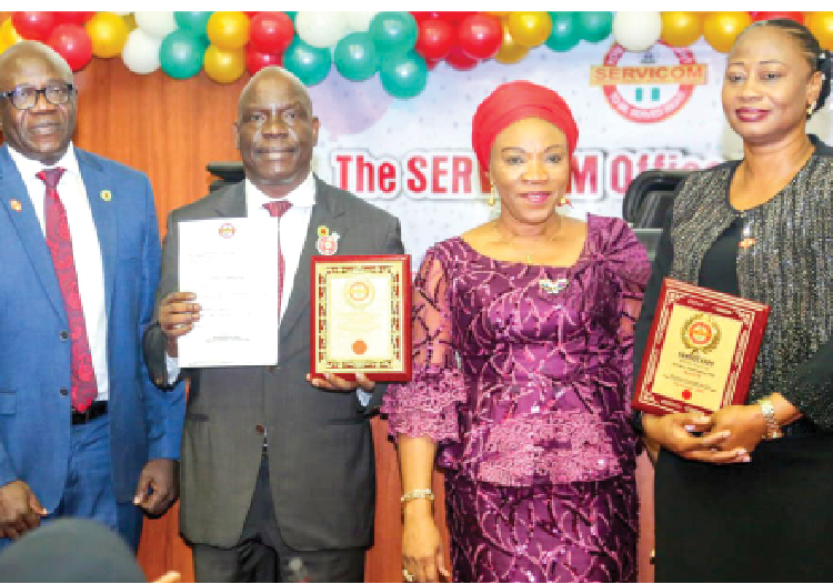 L-R: Executive commissioner, Exploration and Production, Nigerian Upstream Petroleum Regulatory Commission (NUPRC), Enorense Amadasu;  
chief executive, NUPRC, Gbenga Komolafe;  CEO of SERVICOM, Nnenna Akajemeli and head of SERVICOM Unit in NUPRC, Ann Dozie-Enukora after receiving multiple recognitions at the SERVICOM Awards in Abuja on Tuesday.