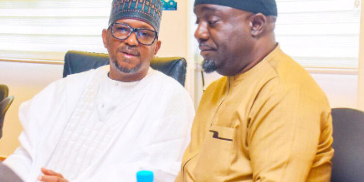 L-R: Chairman, National Sports Commission, Malam Shehu Dikko and director general, Bukola Olopade