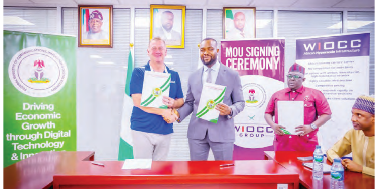 Minister of Communications, Innovation and Digital Economy, Dr Bosun Tijani, in handshake with WIOCC Group’s Chief Development Officer, Mr. Darren Bedford, after signing a Memorandum of Understanding (MoU) in Abuja