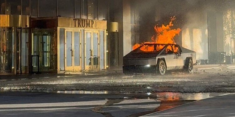 Flames rise from a Tesla Cybertruck after it exploded outside the Trump International Hotel Las Vegas, in Las Vegas, Nevada, U.S., January 1, 2025 in this screengrab taken from a social media video. Alcides Antunes/via REUTERS  THIS IMAGE HAS BEEN SUPPLIED BY A THIRD PARTY. MANDATORY CREDIT. NO RESALES. NO ARCHIVES. THIS PICTURE WAS PROCESSED BY REUTERS TO ENHANCE QUALITY. AN UNPROCESSED VERSION HAS BEEN PROVIDED SEPARATELY.      TPX IMAGES OF THE DAY