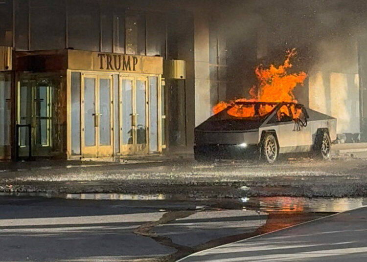 Flames rise from a Tesla Cybertruck after it exploded outside the Trump International Hotel Las Vegas, in Las Vegas, Nevada, U.S., January 1, 2025 in this screengrab taken from a social media video. Alcides Antunes/via REUTERS  THIS IMAGE HAS BEEN SUPPLIED BY A THIRD PARTY. MANDATORY CREDIT. NO RESALES. NO ARCHIVES. THIS PICTURE WAS PROCESSED BY REUTERS TO ENHANCE QUALITY. AN UNPROCESSED VERSION HAS BEEN PROVIDED SEPARATELY.      TPX IMAGES OF THE DAY