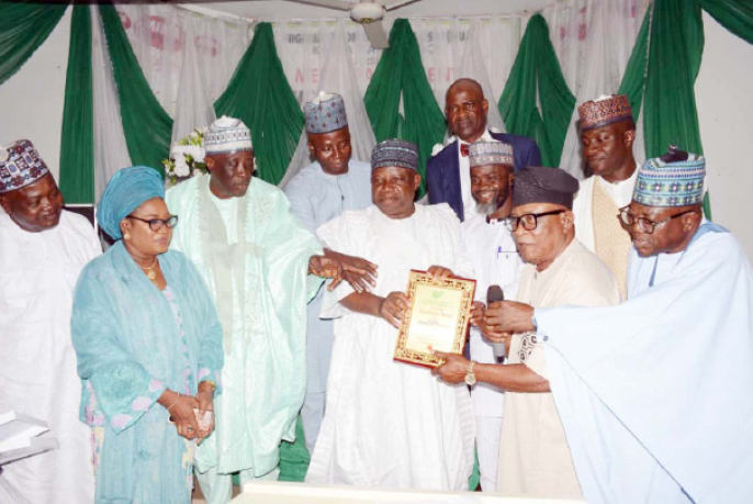 When Kwara NUJ Honoured The Stars 1 Senior adviser/counselor, Alhaji Saadu Salahu (4th left) receiving the award on behalf of Governor AbdulRahman AbdulRazaq.