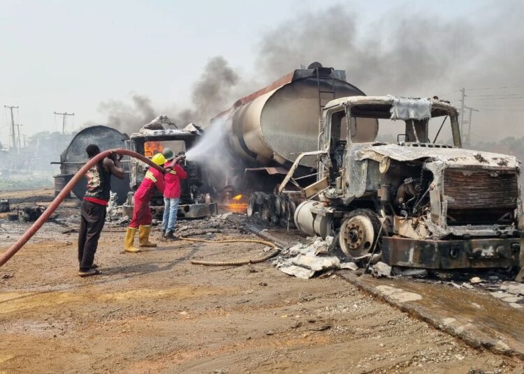 Firefighters extinguish fire from a tanker that exploded in Suleja, Nigeria, Saturday, Jan. 18, 2025. (AP Photo/Arise News)