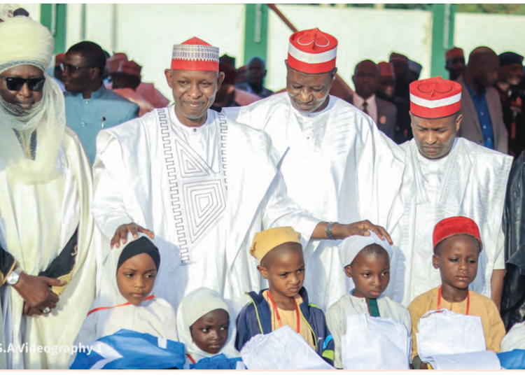 Kano State Governor Abba Yusuf (2nd left) with other government officials while distributing free uniforms to public primary schools across the 44 LGAs in the state.