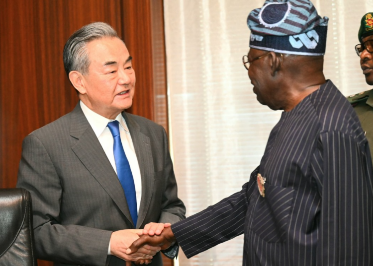 President Bola Tinubu (right) and Chinese Foreign Minister, Wang Yi (left), at the State House, Abuja, on Thursday.