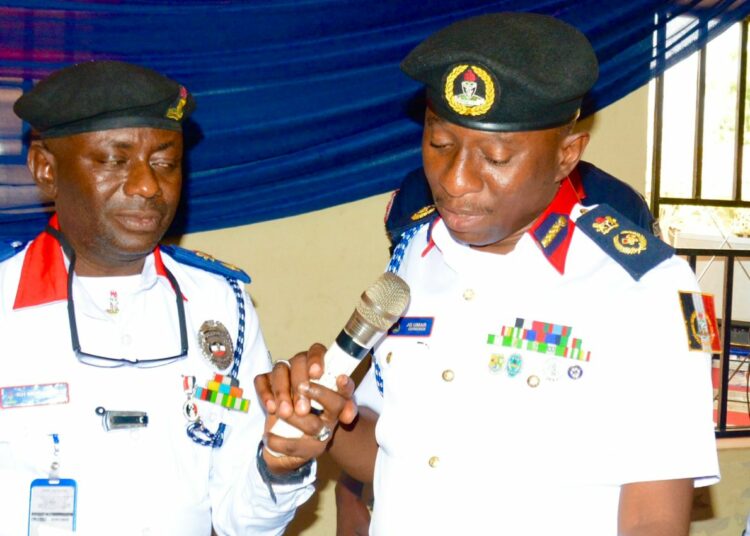 The Kwara State Commandant of NSCDC, Dr Umar Muhammed (right), delivering his address at the security summit on Safe School Initiative in Ilorin, the state capital. Photo by Abdullahi Olesin, Ilorin.