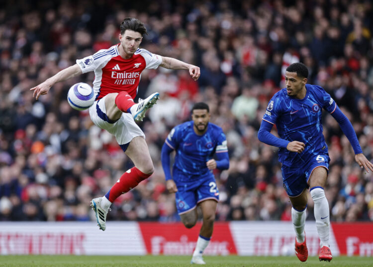 Arsenal's English midfielder #41 Declan Rice controls the ball during the English Premier League football match between Arsenal and Chelsea at the Emirates Stadium in London on March 16, 2025. (Photo by BENJAMIN CREMEL / AFP) / RESTRICTED TO EDITORIAL USE. No use with unauthorized audio, video, data, fixture lists, club/league logos or 'live' services. Online in-match use limited to 120 images. An additional 40 images may be used in extra time. No video emulation. Social media in-match use limited to 120 images. An additional 40 images may be used in extra time. No use in betting publications, games or single club/league/player publications. /