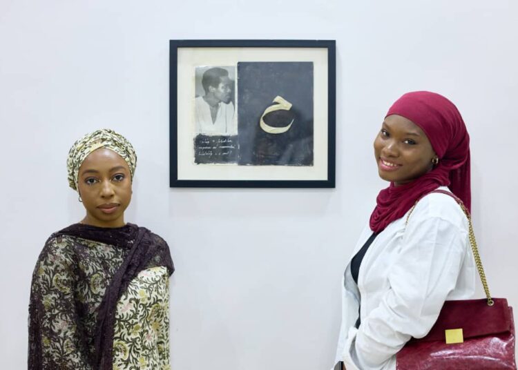 L-R: Aida Oluwagbemiga, curator of "In with the Old: Repurposed" with guest Rukayya Ovayoza at the Dike Chukwumerije Center.