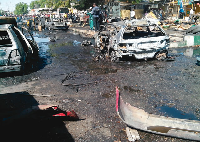 2 LEA Staff Killed In Bomb Blast On Borno Highway 1 A bomb blast scene by Boko Haram at the post office area of Maiduguri in Borno … in 2014
