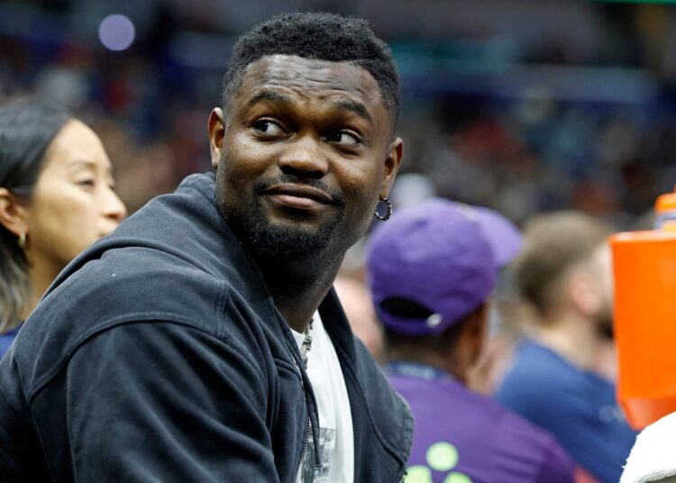 NEW ORLEANS, LOUISIANA - APRIL 13: Zion Williamson #1 of the New Orleans Pelicans sits on the bench during the first half of a game against the Oklahoma City Thunder at Smoothie King Center on April 13, 2025 in New Orleans, Louisiana. NOTE TO USER: User expressly acknowledges and agrees that, by downloading and or using this photograph, User is consenting to the terms and conditions of the Getty Images License Agreement.   Tyler Kaufman/Getty Images/AFP (Photo by Tyler Kaufman / GETTY IMAGES NORTH AMERICA / Getty Images via AFP)