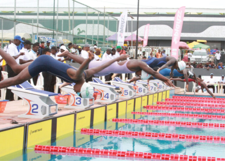 Swimming back stroke action at the ongoing 22nd National Sports Festival at the MKO Abiola Arena in Ogun State, yesterday. PHOTO BY GBENGA  ABIOLA