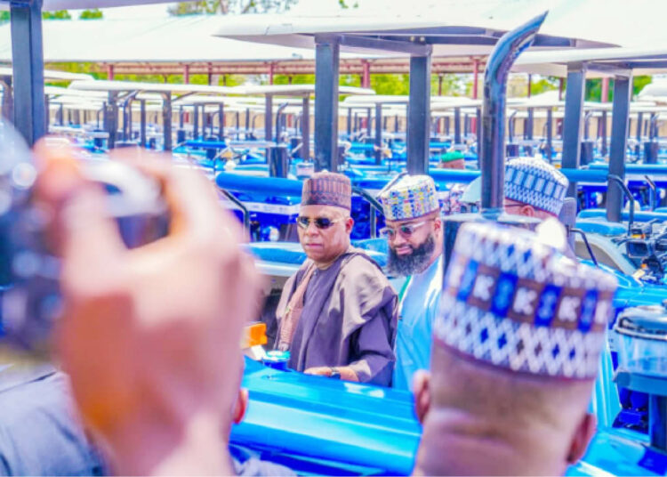 L-R: Vice President Kashim Shettima and the EVC/CEO of NASENI,  Khalil Suleiman Halilu, during the commissioning of the 375 tractors restored by the Agency in Borno State.