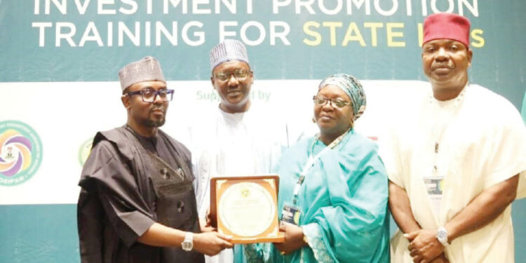 Members of FoSIPAN leadership, Muhktar Nadama ( 2nd L), Maryam Shehu ( 2nd R)  and Anthony Elekeokwuri ( R) presenting Award of Champion of Subnational Investment Reform to Governor Muhammad Inuwa Yahaya of Gombe State ( Represented by Commissioner of Finance,  Muhammad Gambo Magaji).