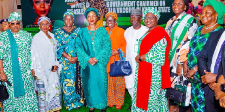 First Lady of Kwara State, Amb. Olufolake AbdulRazaq(5th left) and spouses of LG chairmen at a sensitisation programme on the forthcoming measles and rubella vaccination exercise in the state. PHOTO BY ABDULLAHI OLESIN, ILORIN