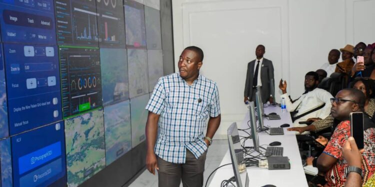 Bright Echefu, President/MD of EIB Group explaining to journalists during a media tour how fighter drones are controlled and deployed to attack terrorists from its station in Abuja.