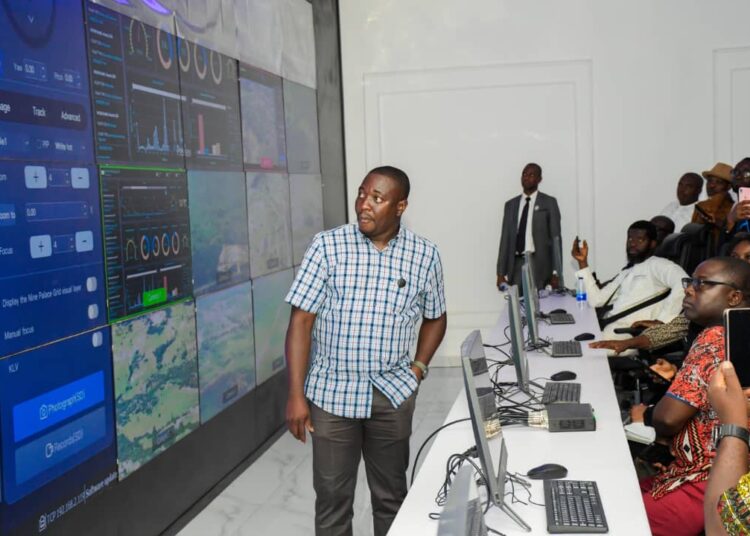 Bright Echefu, President/MD of EIB Group explaining to journalists during a media tour how fighter drones are controlled and deployed to attack terrorists from its station in Abuja.