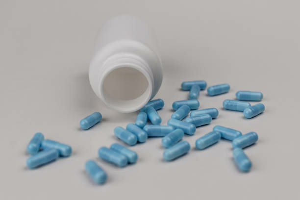 Drug Abuse: Time To Confront The Issue 1 Close up view of generic blue pills. Opiate and heroin overdoses have skyrocketed in recent years IV