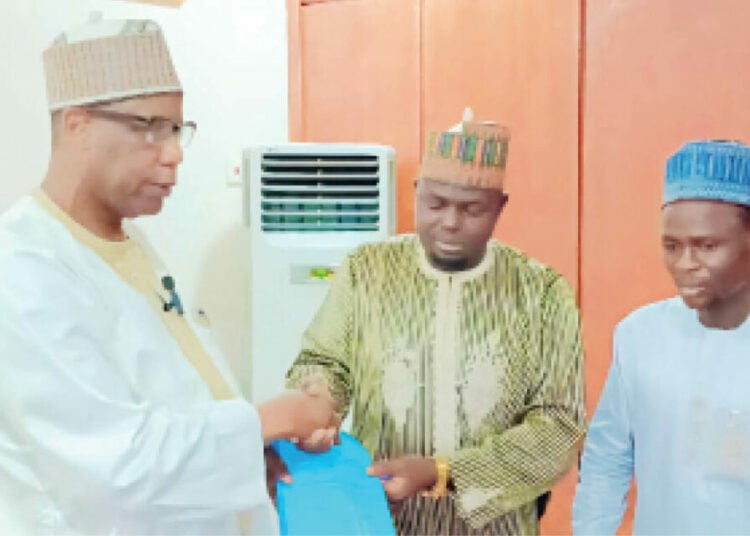 Yobe State Commissioner of Wealth Creation, Alh. Aji Yerima Bularafa (Left) shortly after the signing of the over N442m contract for the supply of barbershop equipment in Damaturu.