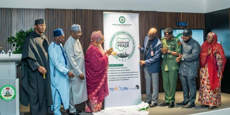 Unveiling of the official logo of the National Community Violence Reduction Programme by the Honourable Minister of Women Affairs and Social Development, Hon Imaan Sulaiman-Ibrahim; National Coordinator National Counter Terrorism Centre (NCTC), Maj. Gen. AG Laka; Director Preventing and Countering Violence Extremism - NCTC, Amb. Mairo Musa Abbas; Director General Nigeria Governors Forum, Dr. Abdullateef Shittu; Chairman Gray Child Foundation, Dr. Pietro Uzochukwu Macleo; Executive Director, Rotary Action Group for Peace – Nigeria Chapter, Mr. Mohammed Ndus Dantata; HRH. Luka Ayedoo Nizassan III (Esu of Kwali); and the Representative of the Honourable Minister of Defence