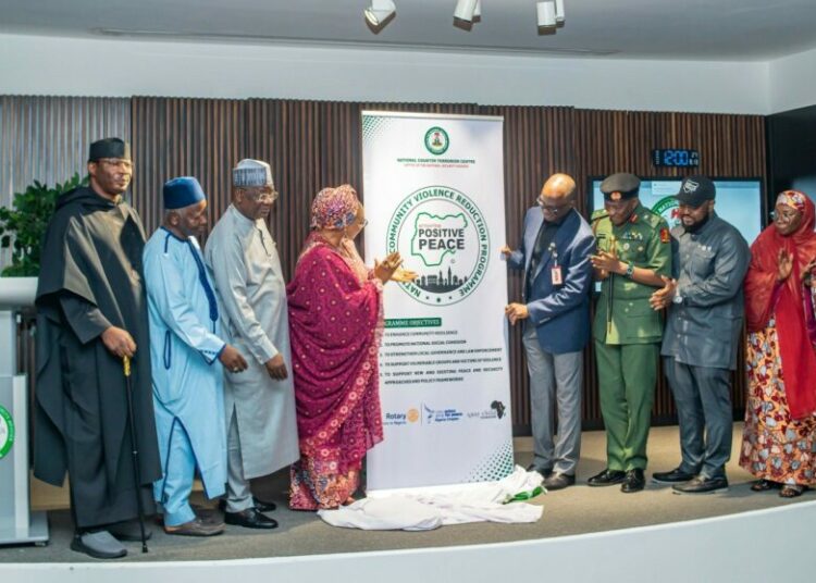 Unveiling of the official logo of the National Community Violence Reduction Programme by the Honourable Minister of Women Affairs and Social Development, Hon Imaan Sulaiman-Ibrahim; National Coordinator National Counter Terrorism Centre (NCTC), Maj. Gen. AG Laka; Director Preventing and Countering Violence Extremism - NCTC, Amb. Mairo Musa Abbas; Director General Nigeria Governors Forum, Dr. Abdullateef Shittu; Chairman Gray Child Foundation, Dr. Pietro Uzochukwu Macleo; Executive Director, Rotary Action Group for Peace – Nigeria Chapter, Mr. Mohammed Ndus Dantata; HRH. Luka Ayedoo Nizassan III (Esu of Kwali); and the Representative of the Honourable Minister of Defence