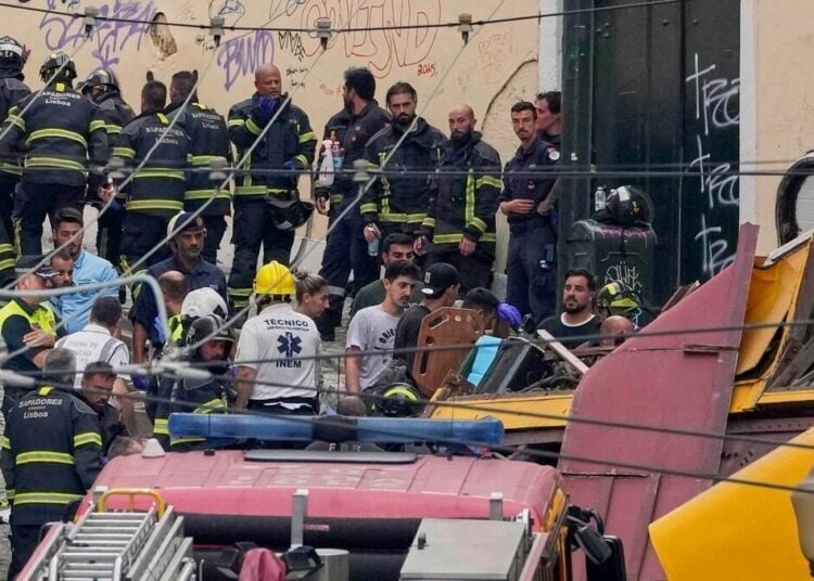 Emergency teams work at the site of a derailed electric streetcar in Lisbon, Portugal, Wednesday, Sept. 3, 2025. (AP Photo/Armando Franca)