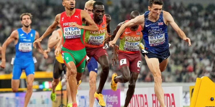 Portugal's Isaac Nader celebrates after winning the gold medal ahead of Britain's Jake Wightman in the men's 1,500 meters final at the World Athletics Championships in Tokyo, Wednesday, Sept. 17, 2025. (AP Photo/Petr David Josek)