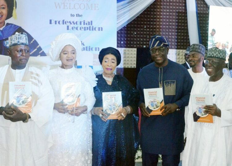 From left: Husband of the celebrant, Pastor Joseph Enape; celebrant/author, Prof. Victoria Enape; Mother of the Day, Dr Titi Abubakar; Book Presenter, Prof. Sebastine Hon and the Special Guest of Honour, retired Capt. Idris Wada, during the Professorial Reception and Book presentation titled ‘‘Financial Literacy: Navigating Wealth in the 21st Century’’ in honour of Prof. Enape, in Abuja.