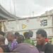 Police Officer, Passenger Die As 40ft Container Crushes Tricycle In Lagos