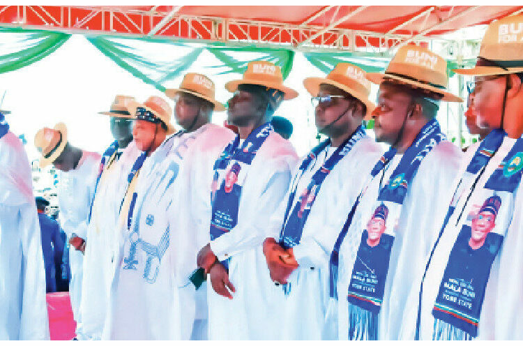 Yobe ALGON, Chairman, Hon Bukar Adamu (In Front) supported by the LG Chairmen across the State while houring Gov Buni at the August 27th Stadium Damaturu.