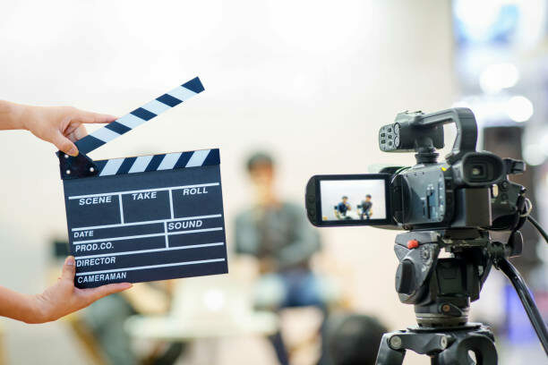 Global Bites Contest: British Council Calls For Short Video Submissions 1 Man hands holding movie clapper.Film director concept.camera show viewfinder image catch motion in interview or broadcast wedding ceremony, catch feeling, stopped motion in best memorial day concept.